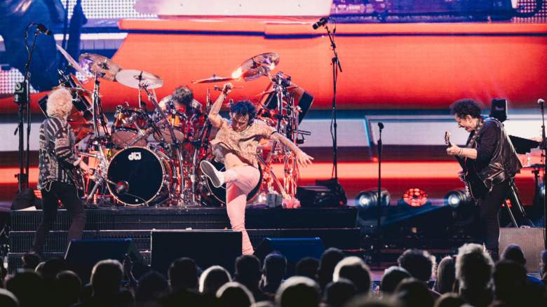 Todd Jensen, Deen Castronovo, Arnel Pineda, and Neal Schon of Journey performing onstage