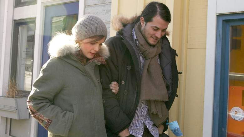 Keri Russell and Shane Deary walk down a street in winter coats.